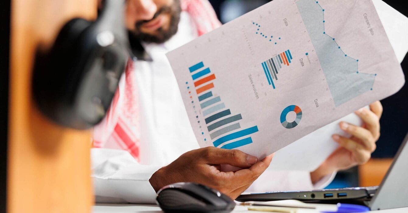 Arab businessman grasping paperwork