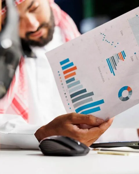 Arab businessman grasping paperwork